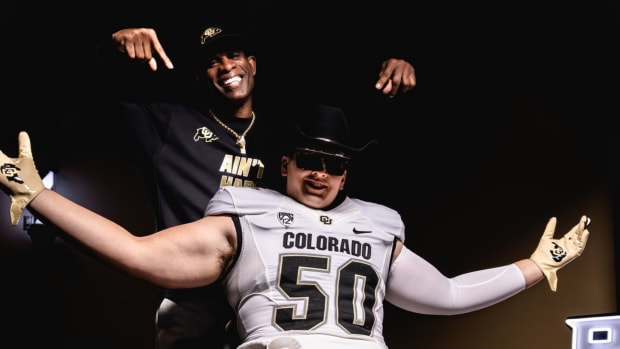 Colorado Buffaloes Talan Chandler poses with Deion Sanders